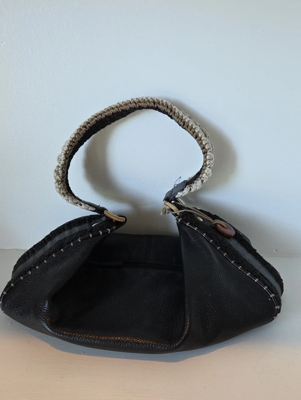 The Sak Pink Label knitted handle black leather handbag.